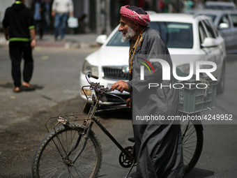 A Palestinian man walks in the street, in Gaza City  May 1, 2019.
 (