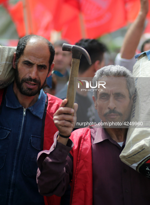 Palestinians take part in a rally marking International Workers' Day, or Labour Day, in Gaza City May 1, 2019. 