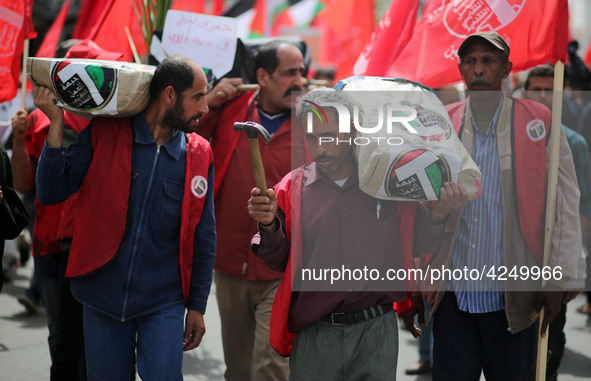 Palestinians take part in a rally marking International Workers' Day, or Labour Day, in Gaza City May 1, 2019. 