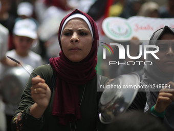 Palestinians  bang on pots during a rally marking International Workers' Day, or Labour Day, in Gaza City May 1, 2019. 
 (