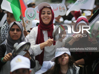 Palestinians  bang on pots during a rally marking International Workers' Day, or Labour Day, in Gaza City May 1, 2019. 
 (