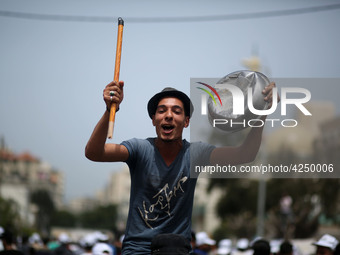 Palestinians  bang on pots during a rally marking International Workers' Day, or Labour Day, in Gaza City May 1, 2019. 
 (