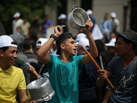 Palestinians  bang on pots during a rally marking International Workers' Day, or Labour Day, in Gaza City May 1, 2019. 
 (