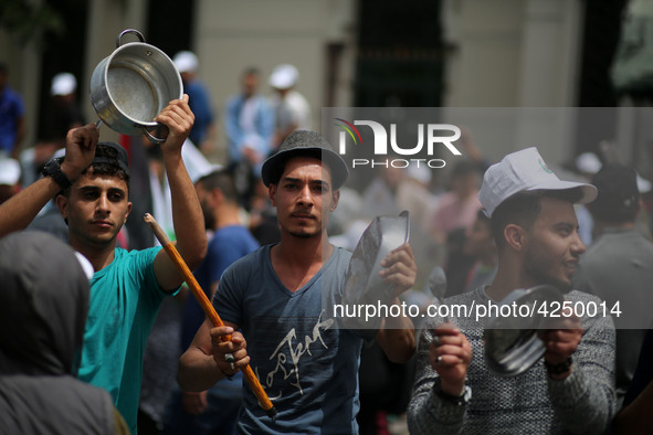 Palestinians  bang on pots during a rally marking International Workers' Day, or Labour Day, in Gaza City May 1, 2019. 
 