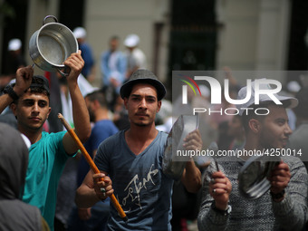 Palestinians  bang on pots during a rally marking International Workers' Day, or Labour Day, in Gaza City May 1, 2019. 
 (