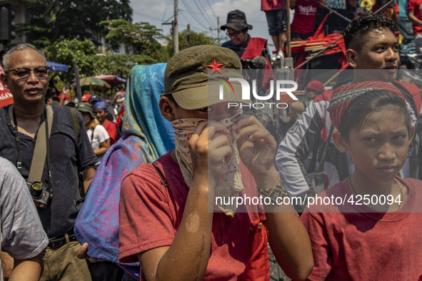 A protester takes part in Labor Day demonstrations outside the presidential palace on May 1, 2019 in Manila, Philippines. Thousands of Filip...