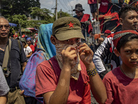 A protester takes part in Labor Day demonstrations outside the presidential palace on May 1, 2019 in Manila, Philippines. Thousands of Filip...