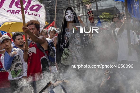 Protesters take part in Labor Day demonstrations outside the presidential palace on May 1, 2019 in Manila, Philippines. Thousands of Filipin...