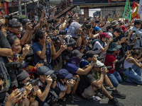 Photographers and cameramen cover protesters taking part in Labor Day demonstrations outside the presidential palace on May 1, 2019 in Manil...