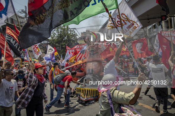 Protesters take part in Labor Day demonstrations outside the presidential palace on May 1, 2019 in Manila, Philippines. Thousands of Filipin...