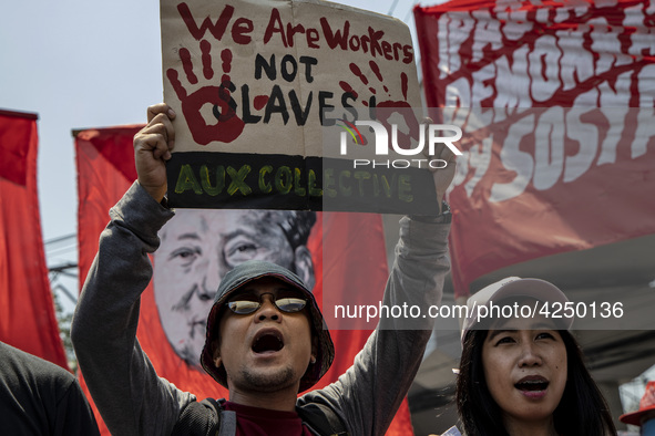 Protesters shout slogans as they take part in Labor Day demonstrations outside the presidential palace on May 1, 2019 in Manila, Philippines...