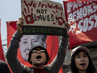 Protesters shout slogans as they take part in Labor Day demonstrations outside the presidential palace on May 1, 2019 in Manila, Philippines...