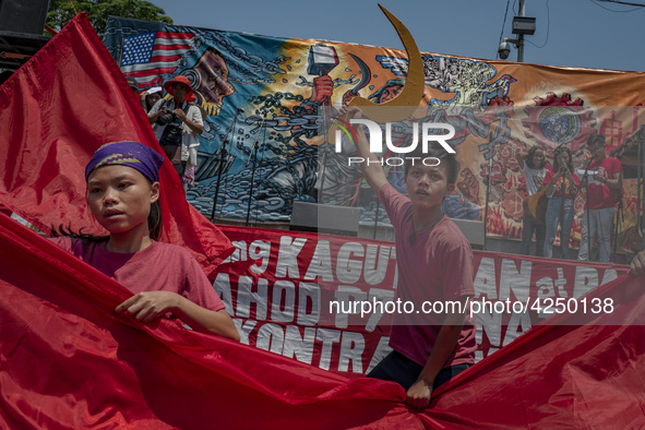 Protesters take part in Labor Day demonstrations outside the presidential palace on May 1, 2019 in Manila, Philippines. Thousands of Filipin...