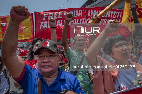 Protesters shout slogans as they take part in Labor Day demonstrations outside the presidential palace on May 1, 2019 in Manila, Philippines...