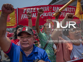 Protesters shout slogans as they take part in Labor Day demonstrations outside the presidential palace on May 1, 2019 in Manila, Philippines...