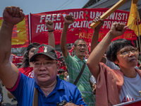 Protesters shout slogans as they take part in Labor Day demonstrations outside the presidential palace on May 1, 2019 in Manila, Philippines...