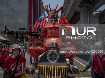 Protesters parade an effigy of Philippine President Rodrigo Duterte as they take part in Labor Day demonstrations outside the presidential p...