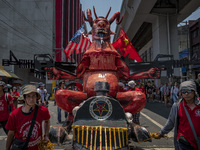 Protesters parade an effigy of Philippine President Rodrigo Duterte as they take part in Labor Day demonstrations outside the presidential p...