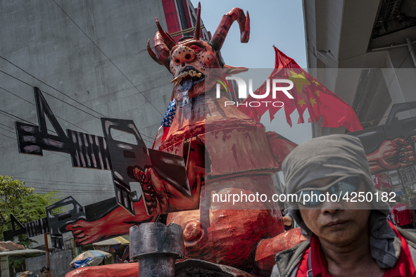 Protesters parade an effigy of Philippine President Rodrigo Duterte as they take part in Labor Day demonstrations outside the presidential p...