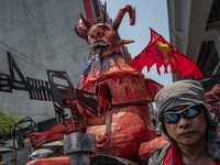 Protesters parade an effigy of Philippine President Rodrigo Duterte as they take part in Labor Day demonstrations outside the presidential p...