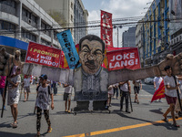 Protesters parade an effigy of Philippine President Rodrigo Duterte as they take part in Labor Day demonstrations outside the presidential p...