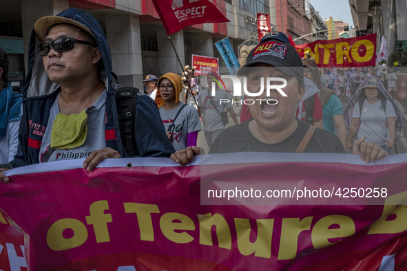 Protesters shout slogans as they take part in Labor Day demonstrations outside the presidential palace on May 1, 2019 in Manila, Philippines...