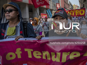 Protesters shout slogans as they take part in Labor Day demonstrations outside the presidential palace on May 1, 2019 in Manila, Philippines...