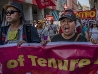 Protesters shout slogans as they take part in Labor Day demonstrations outside the presidential palace on May 1, 2019 in Manila, Philippines...