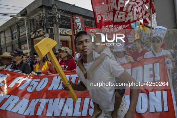 Protesters take part in Labor Day demonstrations outside the presidential palace on May 1, 2019 in Manila, Philippines. Thousands of Filipin...