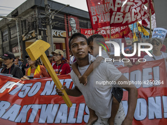 Protesters take part in Labor Day demonstrations outside the presidential palace on May 1, 2019 in Manila, Philippines. Thousands of Filipin...