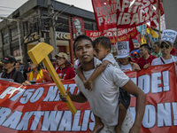 Protesters take part in Labor Day demonstrations outside the presidential palace on May 1, 2019 in Manila, Philippines. Thousands of Filipin...