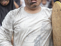 Jakarta, 01 May 2019 : A man with theatrical expression symbolic as how hunger he is as a labor during the demonstration. Thousands of Labor...