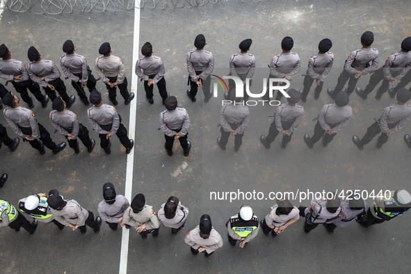 Jakarta, 01 May 2019 : Police form in guarding the demonstration. Thousands of Labor filled Merdeka Barat Street Jakarta celebrating May Day...