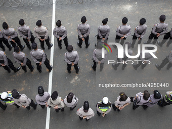 Jakarta, 01 May 2019 : Police form in guarding the demonstration. Thousands of Labor filled Merdeka Barat Street Jakarta celebrating May Day...