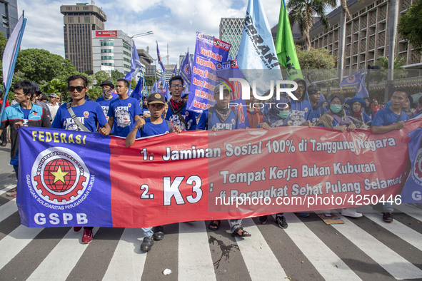 Jakarta, 01 May 2019 :Labors with the banner demanding for more wages ofr labor during the demonstration.  Thousands of Labor filled Merdeka...