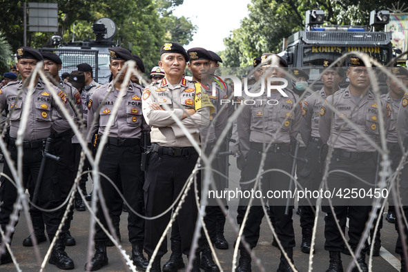 Jakarta, 01 May 2019 : Police guaarding the demonstration with barbwire. Thousands of Labor filled Merdeka Barat Street Jakarta celebrating...