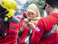 Jakarta, 01 May 2019 : A beautifull hijab Labor during the demonstration. Thousands of Labor filled Merdeka Barat Street Jakarta celebrating...