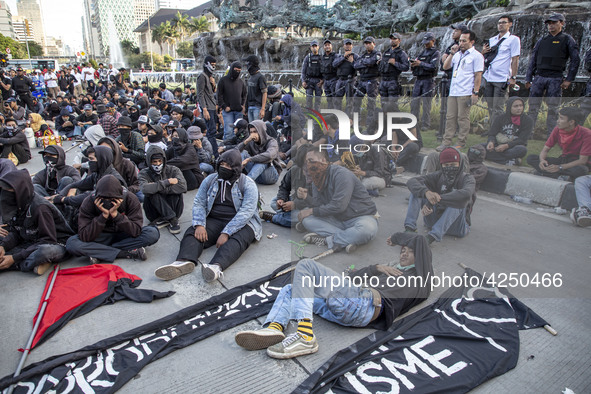 Jakarta, 01 May 2019 : Students that done anarchy demonstration in the morning heavily guard by the police. Thousands of Labor filled Merdek...