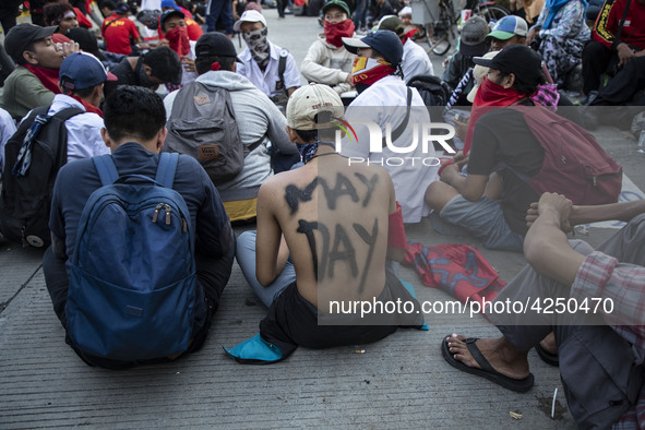 Jakarta, 01 May 2019 : Junior High School student paint his body with "May Day" words. Thousands of Labor filled Merdeka Barat Street Jakart...