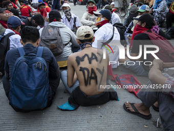 Jakarta, 01 May 2019 : Junior High School student paint his body with "May Day" words. Thousands of Labor filled Merdeka Barat Street Jakart...