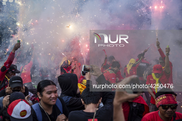 Jakarta, 01 May 2019 : Firecracker at the end of the demonstration. Thousands of Labor filled Merdeka Barat Street Jakarta celebrating May D...