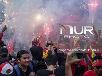 Jakarta, 01 May 2019 : Firecracker at the end of the demonstration. Thousands of Labor filled Merdeka Barat Street Jakarta celebrating May D...