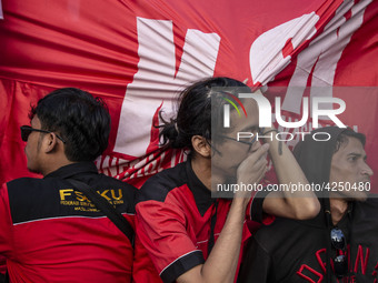 Jakarta, 01 May 2019 : Member of Labors hold to banner after finishing the demonstration. Thousands of Labor filled Merdeka Barat Street Jak...