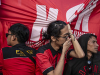 Jakarta, 01 May 2019 : Member of Labors hold to banner after finishing the demonstration. Thousands of Labor filled Merdeka Barat Street Jak...