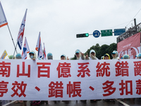 Protesters marching with banners and flags calling for more holidays, paid leave, more labour rights protections. During 2019 Labor Day Marc...