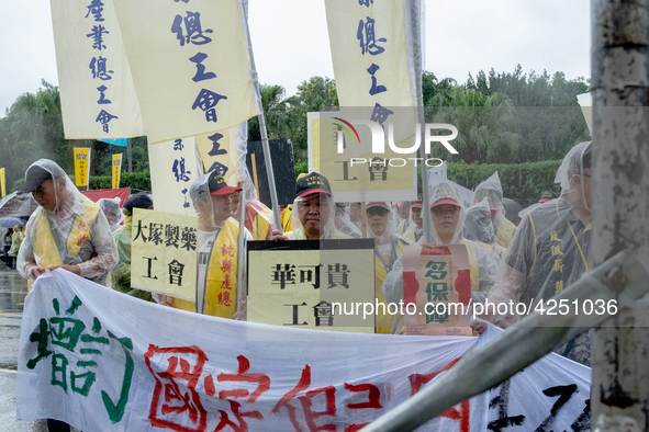 Protesters marching with banners and flags calling for more holidays, paid leave, more labour rights protections. During 2019 Labor Day Marc...