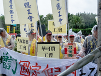 Protesters marching with banners and flags calling for more holidays, paid leave, more labour rights protections. During 2019 Labor Day Marc...