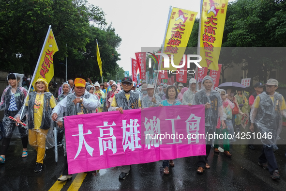 Protesters marching with banners and flags calling for more holidays, paid leave, more labour rights protections. During 2019 Labor Day Marc...