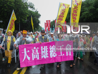 Protesters marching with banners and flags calling for more holidays, paid leave, more labour rights protections. During 2019 Labor Day Marc...