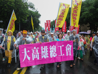 Protesters marching with banners and flags calling for more holidays, paid leave, more labour rights protections. During 2019 Labor Day Marc...